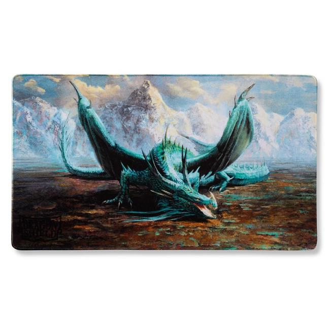 An image if a mint green dragon on all four legs, wings slightly raised. Behind are snowy mountains and underfoot is rust and green moss plateau